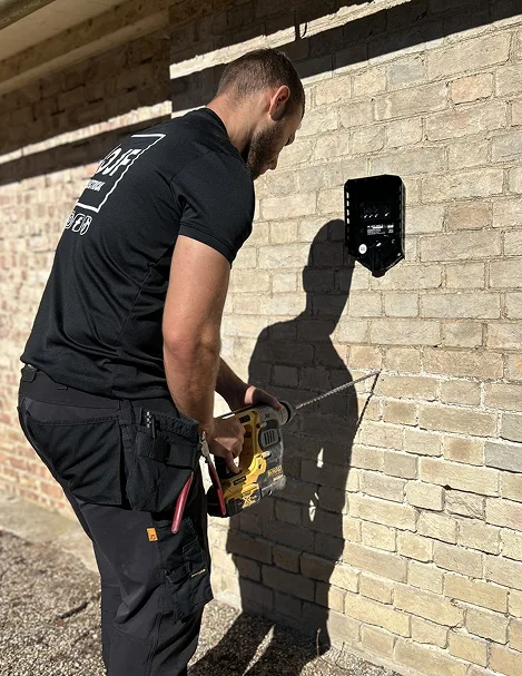 OJF engineer installing an EV charger
