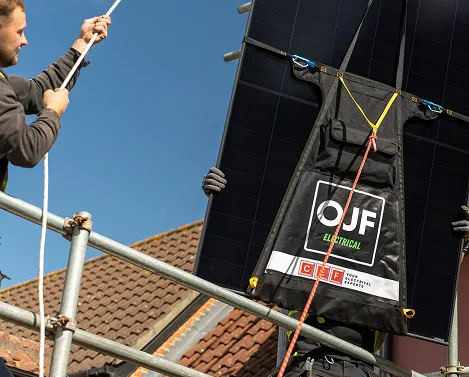 OJF engineer installing solar panels